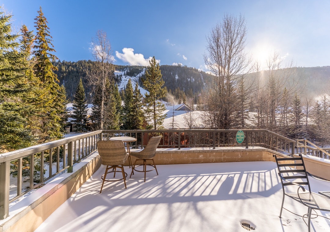 Unwind on your private balcony with stunning mountain views and soak in the hot tub surrounded by winter wonderland.
