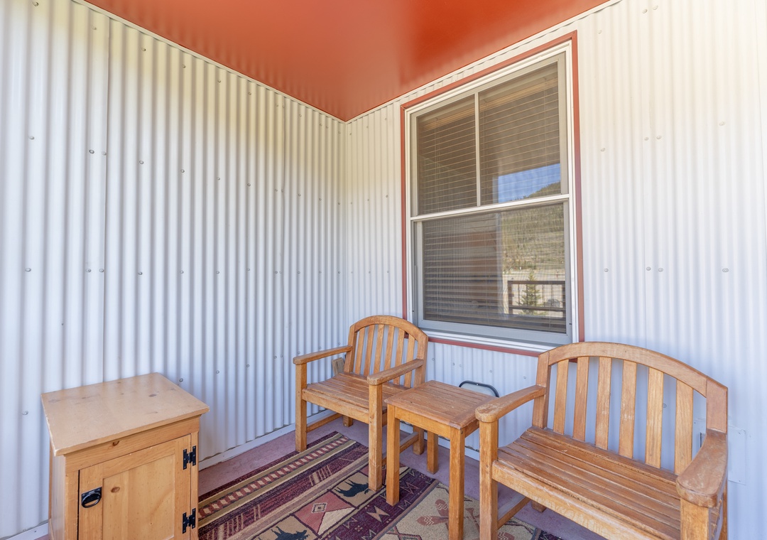 Your private covered patio offers cozy seating where you can enjoy morning coffee or evening relaxation in peaceful comfort.