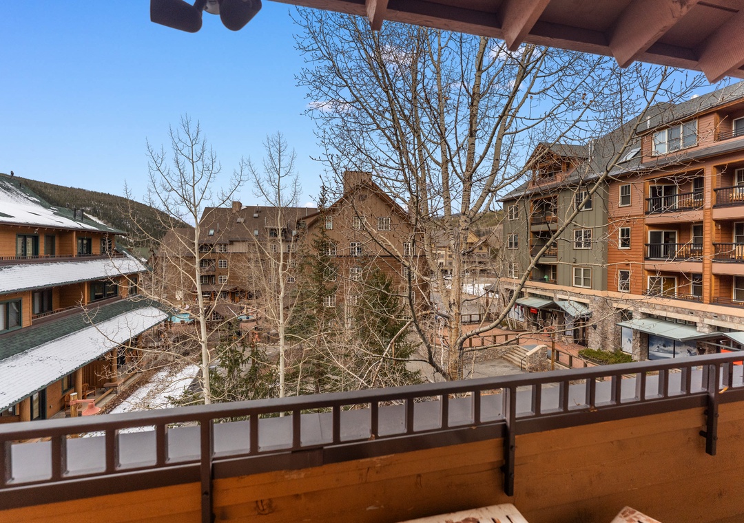 Step onto your private balcony and breathe in the crisp mountain air while enjoying serene courtyard views of the charming alpine village below.