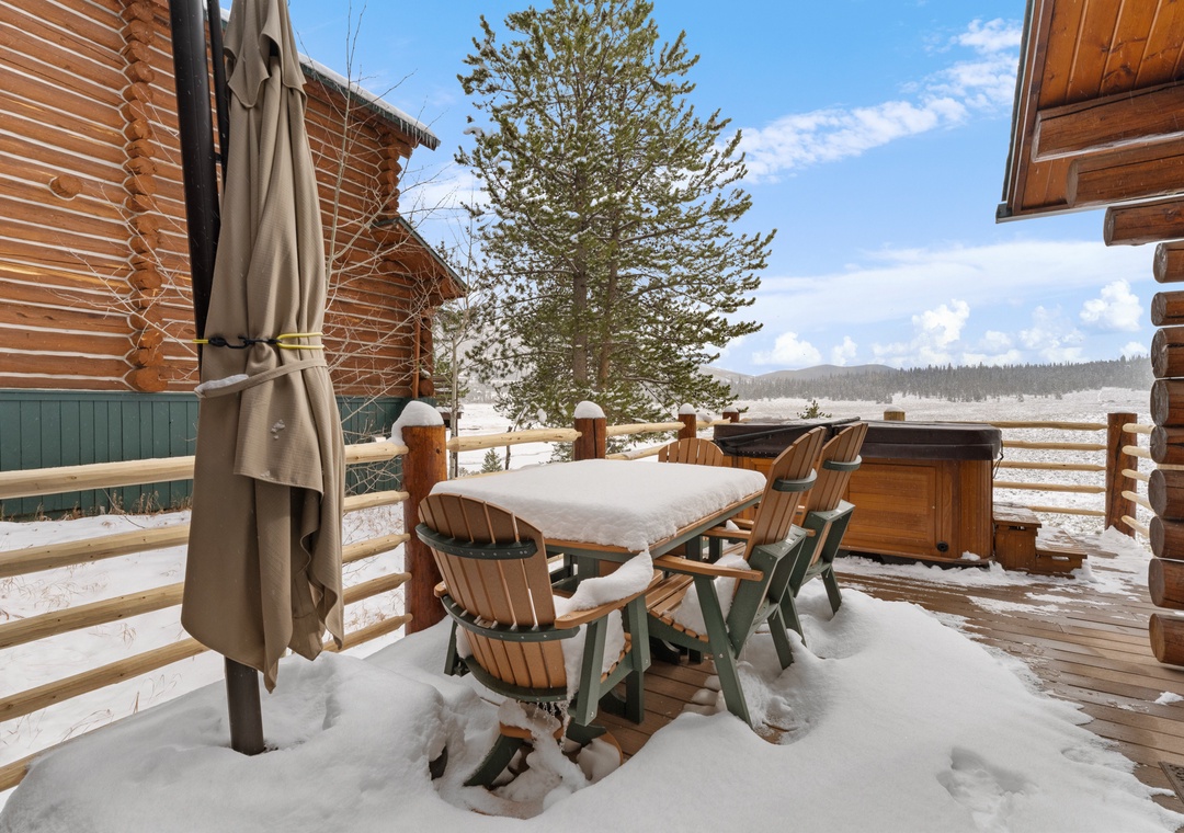 Step onto your private deck where outdoor dining meets winter wonderland views, complete with hot tub for ultimate mountain relaxation.