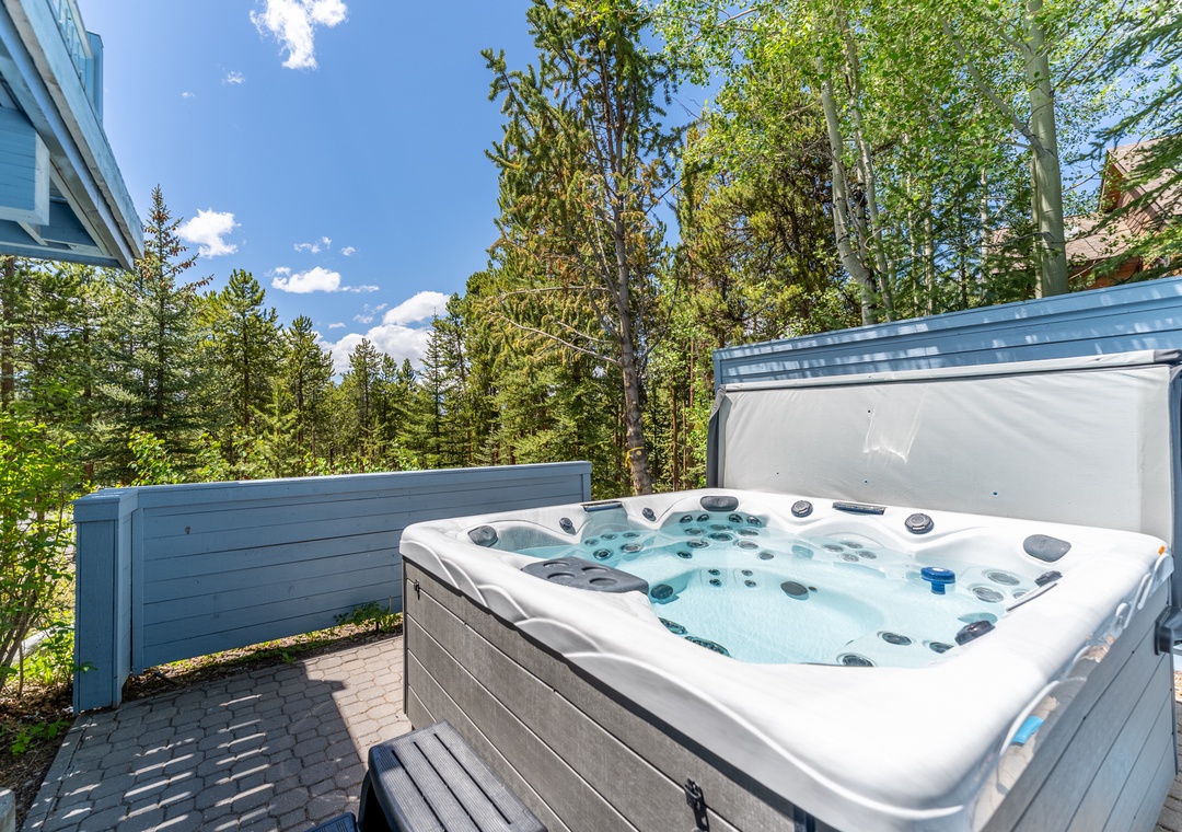Soak in your private hot tub surrounded by towering pines and mountain air, where forest views create the perfect backdrop for relaxation.