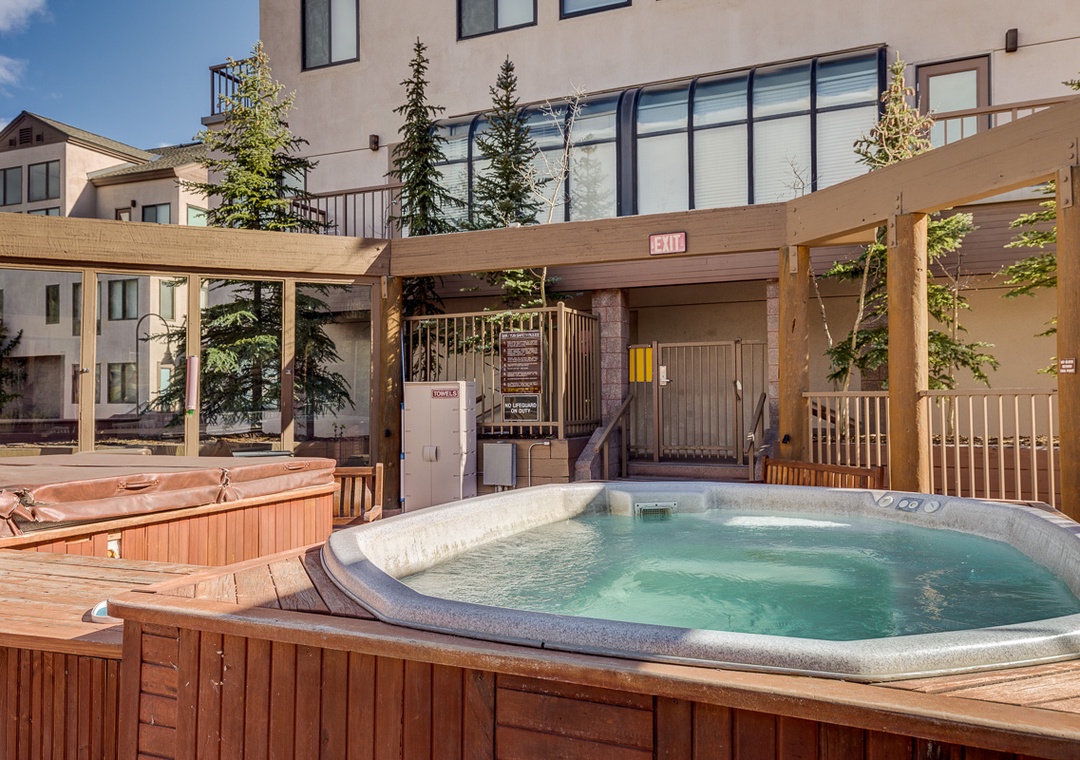 Unwind in the bubbling hot tub on your private deck, surrounded by evergreen trees and mountain charm.