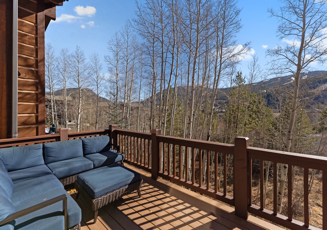 Settle into plush outdoor seating and savor breathtaking mountain vistas from your private deck - perfect for morning coffee or evening relaxation.