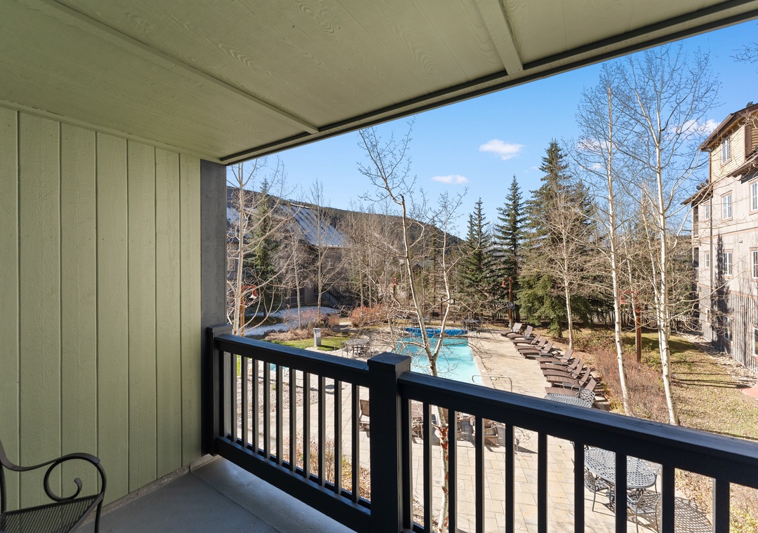Step onto your private balcony and breathe in the mountain air while enjoying stunning views of the pool area below.