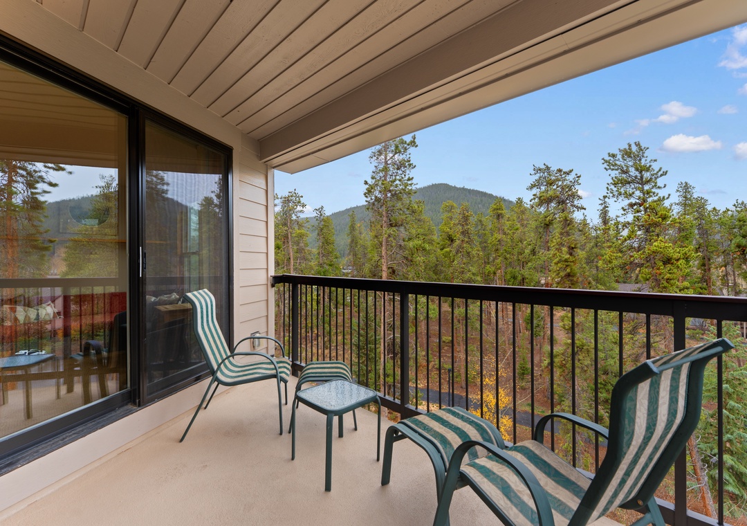 Take in sweeping forest and mountain vistas from your private balcony, where cozy seating invites you to unwind with morning coffee or an evening glass of wine.