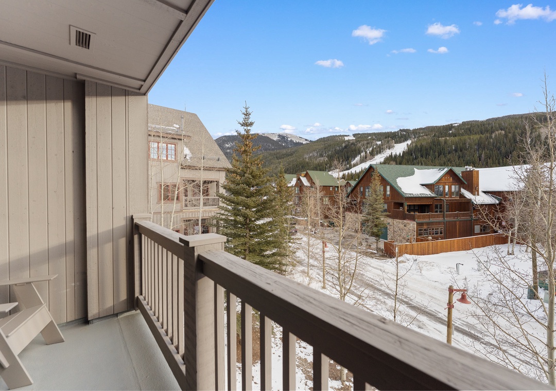 Step onto your private balcony and breathe in crisp mountain air while soaking up stunning winter vistas and cozy neighborhood charm.