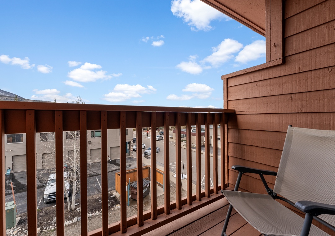 A private balcony with comfortable seating where you can relax under bright blue skies and enjoy the fresh mountain air throughout your stay.