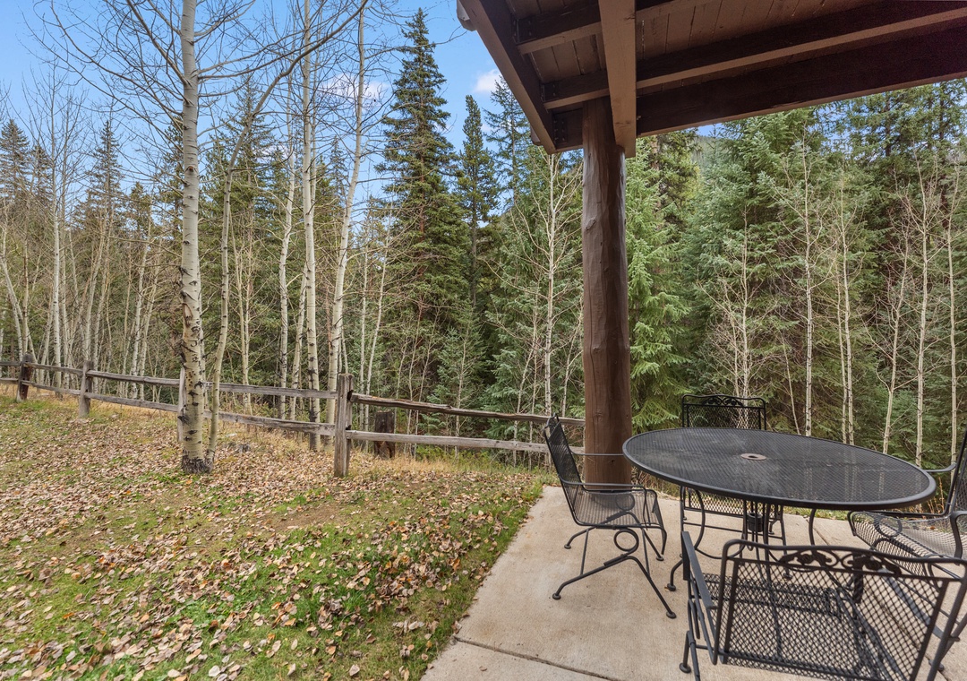 Step onto your private patio and breathe in the crisp mountain air while enjoying peaceful forest views from your outdoor dining space.