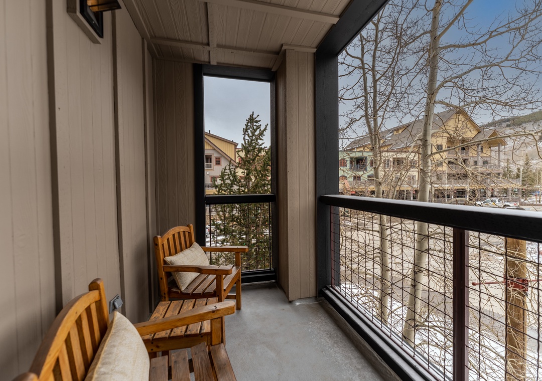 Step onto your private balcony with comfortable seating to enjoy morning coffee while taking in the peaceful neighborhood views.