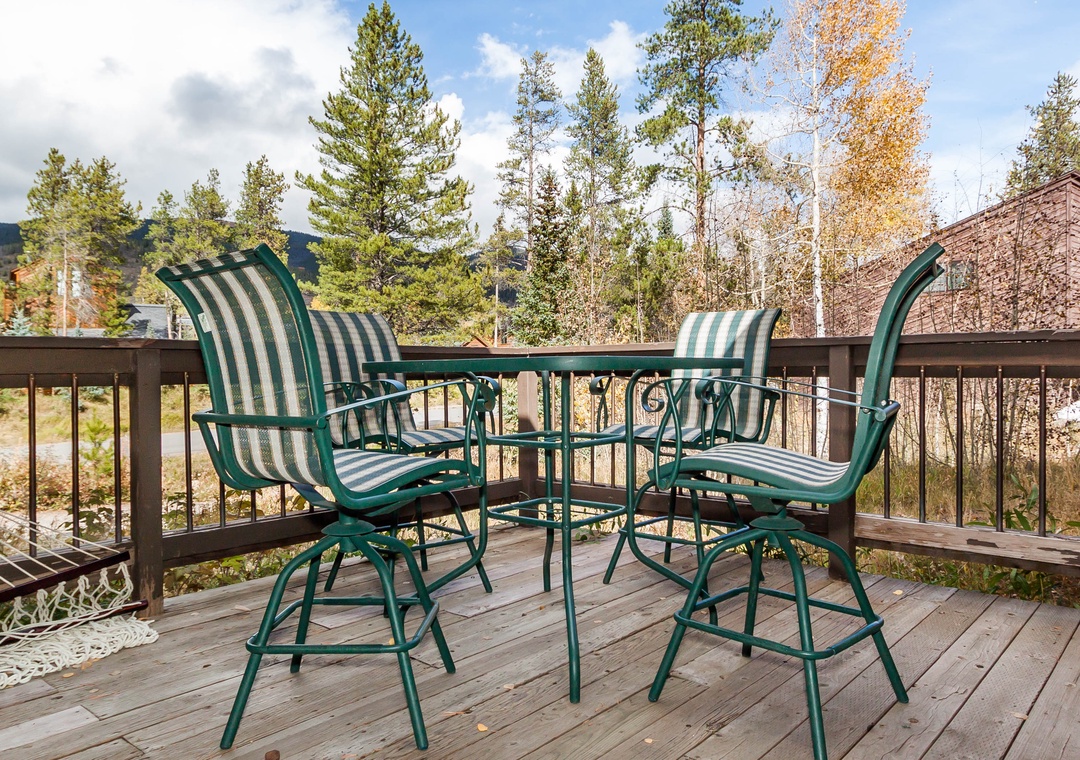Your private deck awaits with comfortable seating where you can savor morning coffee while taking in the peaceful forest and mountain views.