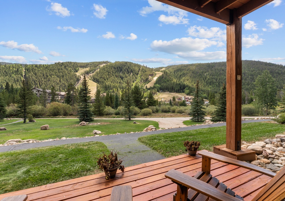 Relax on your private patio surrounded by lush lawns, evergreen forests, and sweeping mountain vistas—your serene alpine retreat awaits.
