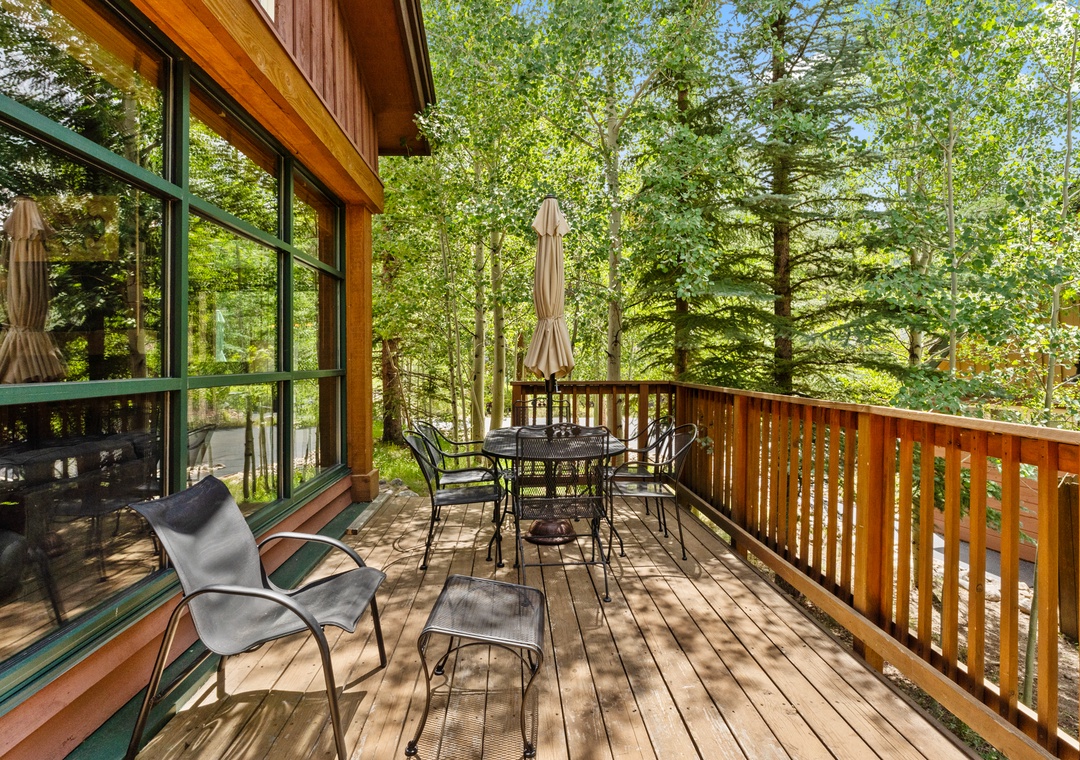 Relax on your private wooden deck surrounded by towering trees, where morning coffee and evening conversations feel perfectly at home.