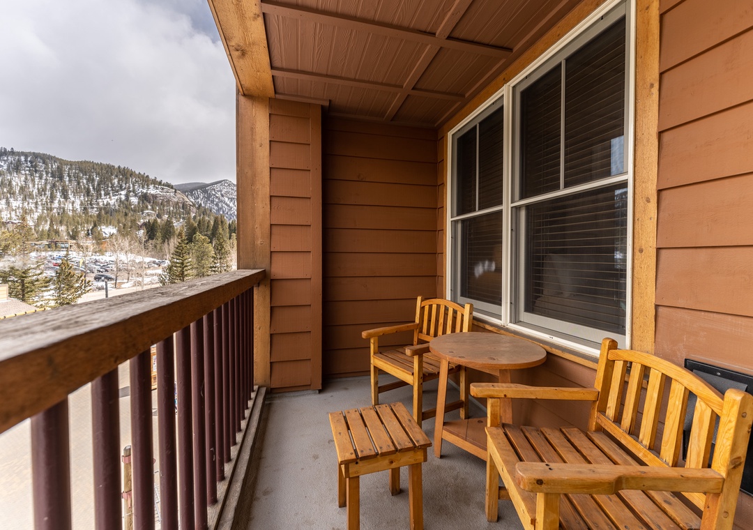 Step onto your private mountain balcony where cozy wooden seating awaits. Sip morning coffee while gazing at snow-capped peaks and valley views.