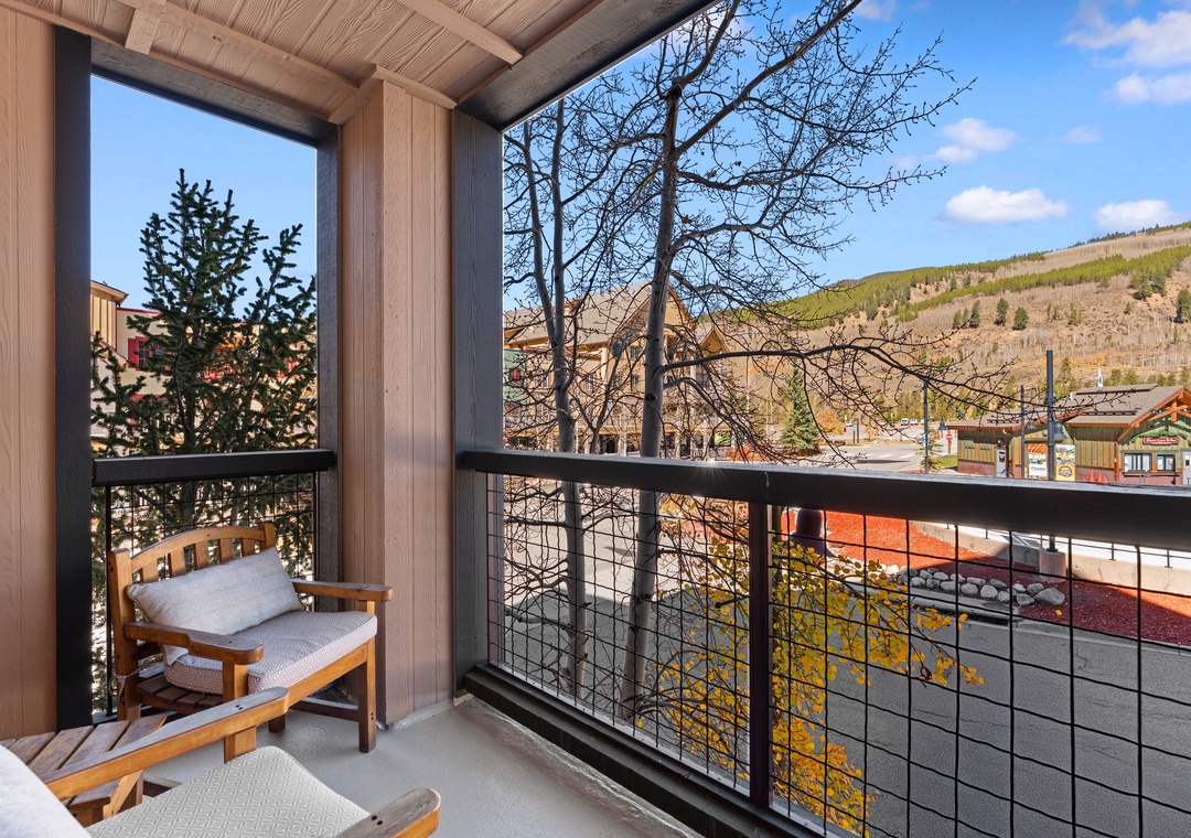 Step onto your private balcony and breathe in fresh mountain air while taking in views of the surrounding slopes and charming village below—your perfect spot to unwind with morning coffee or evening relaxation.