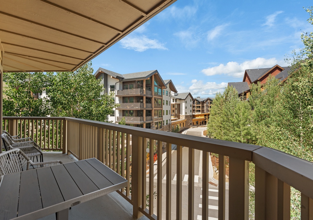 Step onto your private balcony and enjoy peaceful views of neighboring lodges framed by lush greenery—a perfect spot for morning coffee or unwinding after a day outdoors.