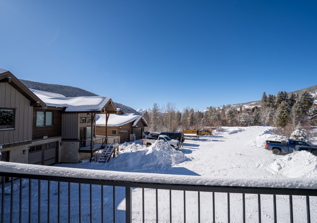 Snowy mountain valley setting with convenient parking and peaceful winter surroundings.