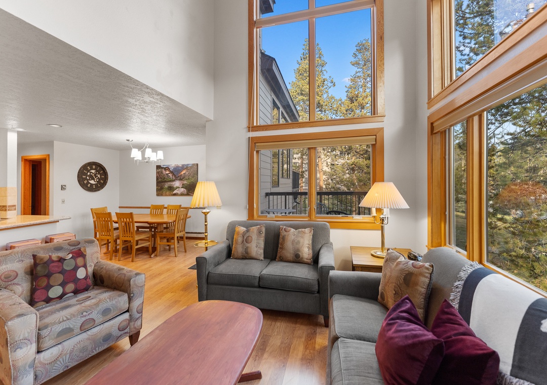 Sink into plush seating while natural light floods through soaring windows, creating your perfect retreat for relaxation and connection.