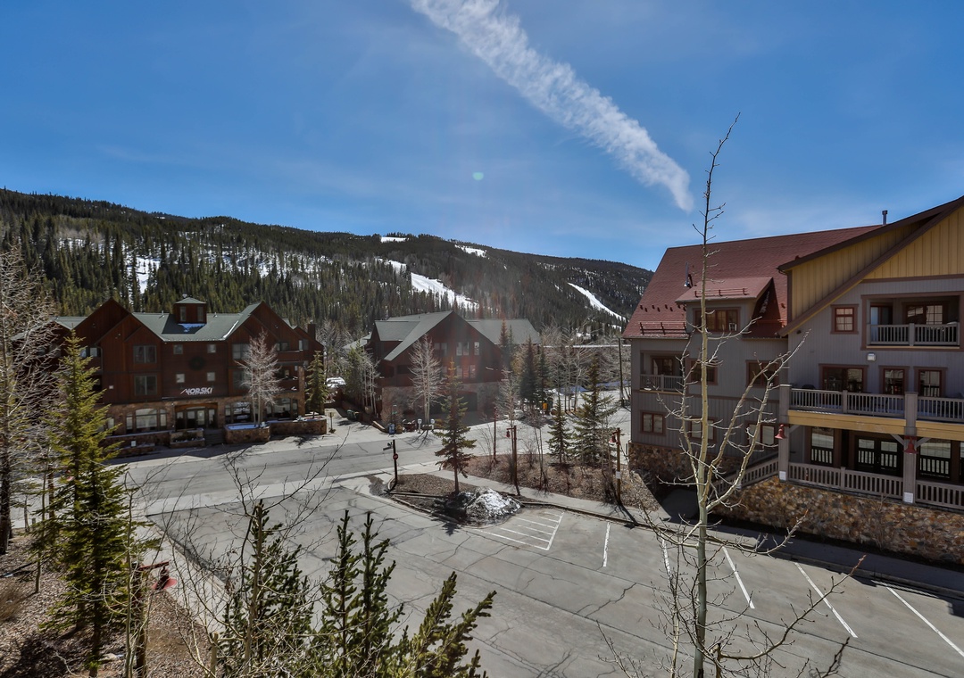 Mountain village setting with ski slopes and alpine buildings creating the perfect winter destination backdrop.