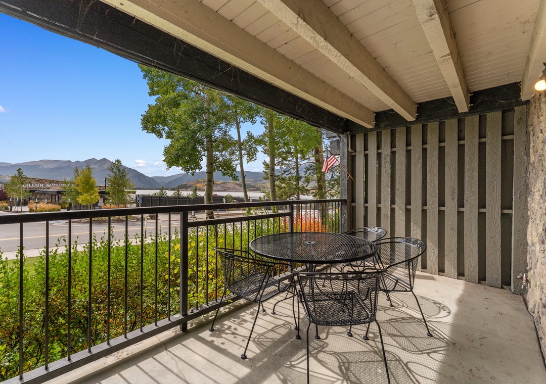 Your private balcony offers stunning mountain views where you can enjoy morning coffee at your outdoor dining table.