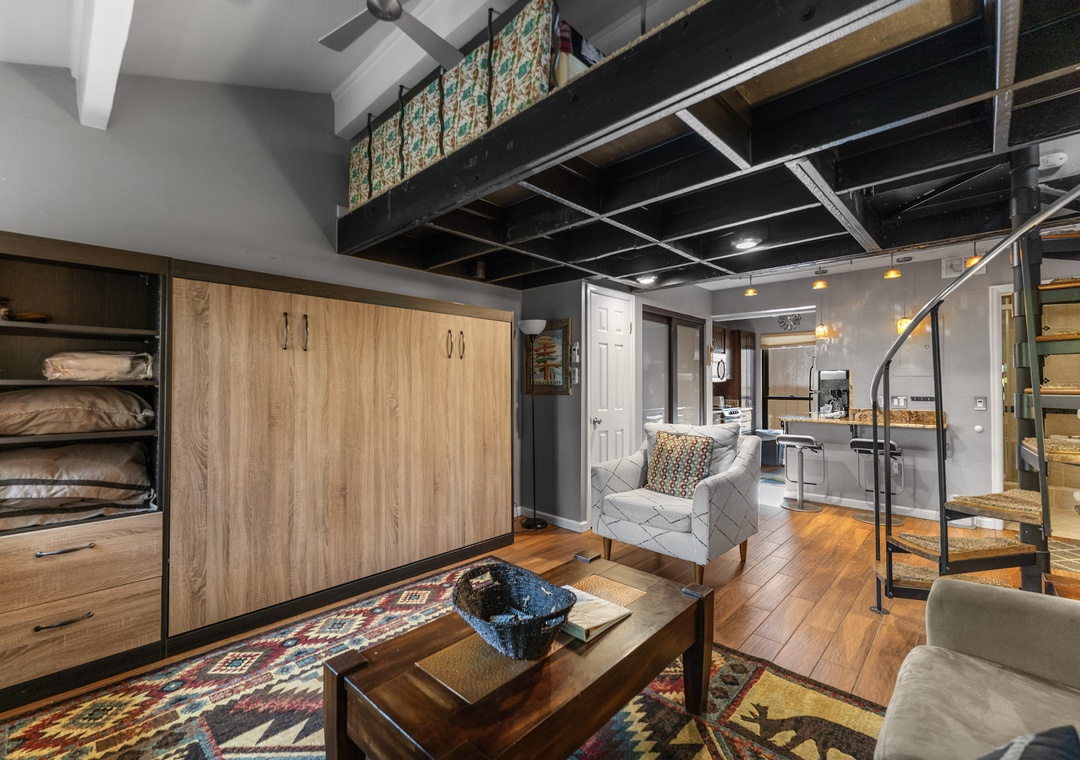 Your cozy loft features a clever Murphy bed and spiral stairs to your private mezzanine retreat.
