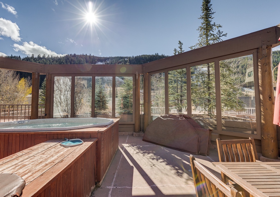 Soak in your private hot tub while surrounded by stunning mountain views and forest scenery from this peaceful covered deck.