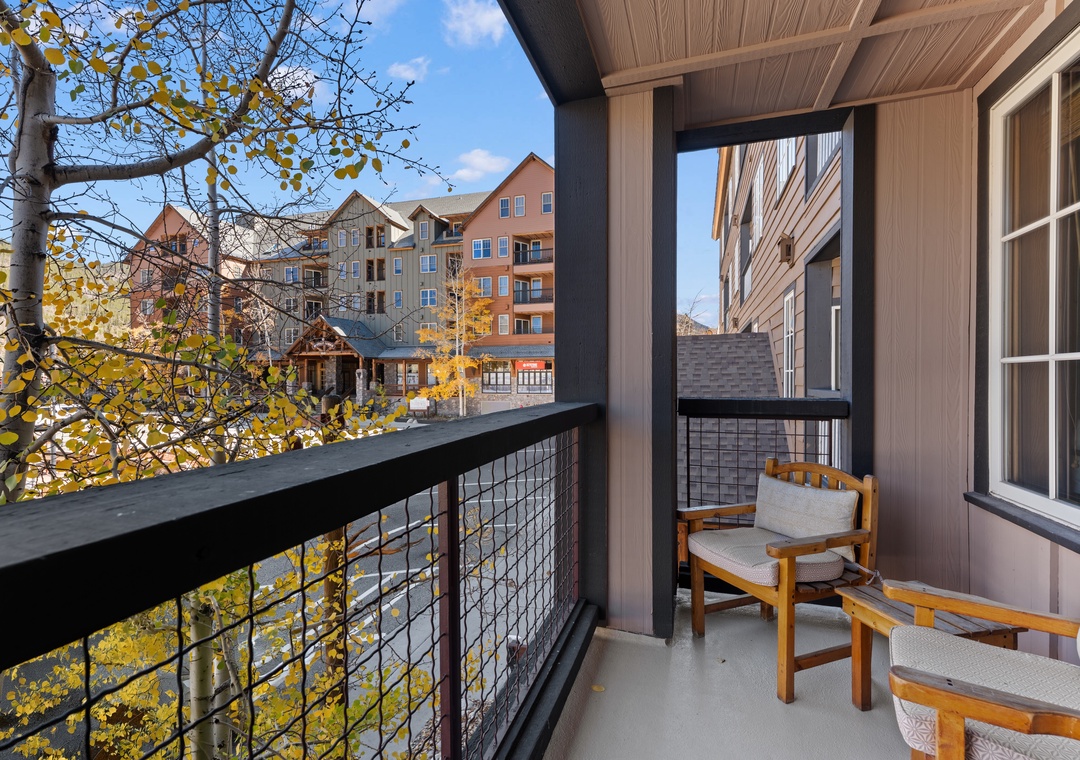 A private balcony perched among golden aspens frames mountain resort views—your perfect spot for morning coffee or evening relaxation after a day of adventure.