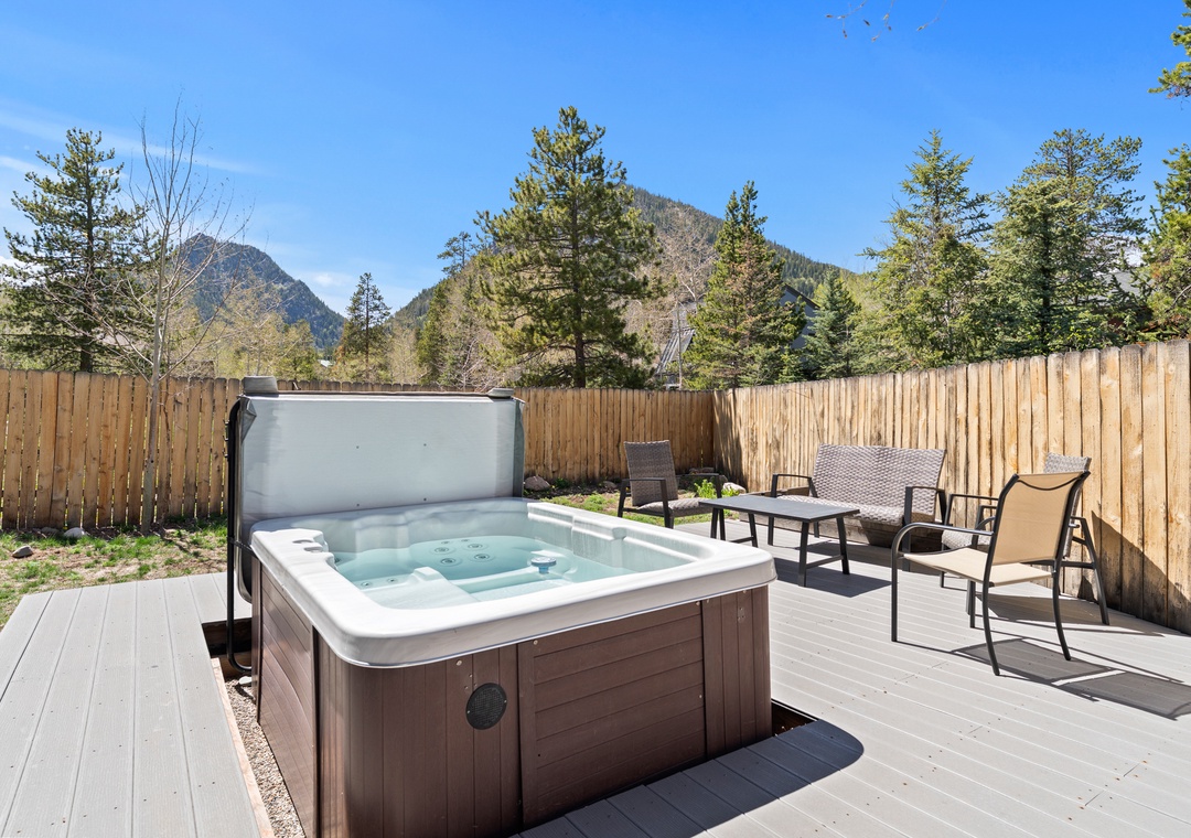 Private backyard with hot tub and mountain views.