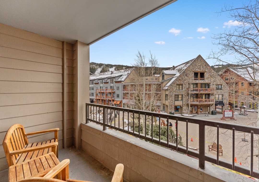 Step onto your private balcony and soak in stunning mountain village views while sipping morning coffee in cozy wooden chairs.
