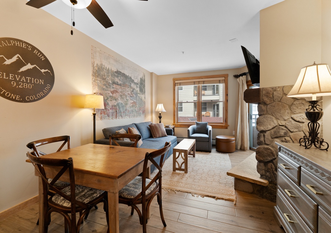 Your cozy mountain retreat blends rustic charm with modern comfort, featuring vaulted ceilings, stone accents, and a welcoming living space where you can unwind after a day exploring Keystone.