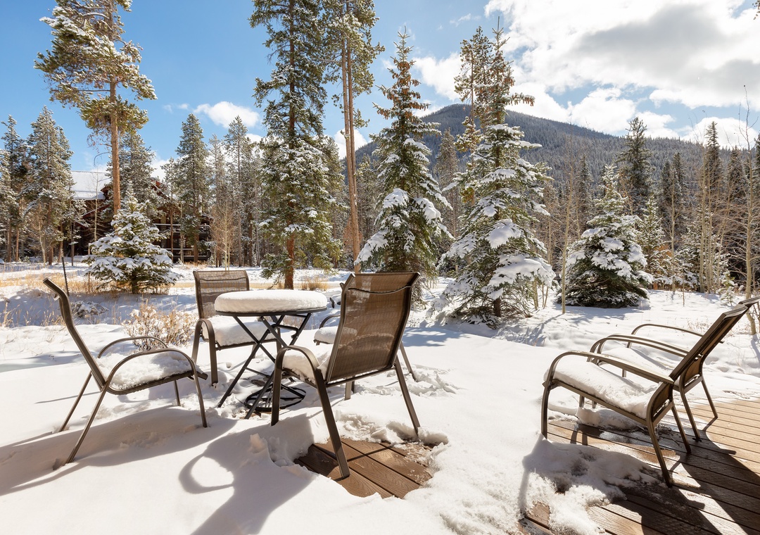 Step onto your private deck and soak in breathtaking mountain views surrounded by snow-dusted evergreens and pristine winter wilderness.
