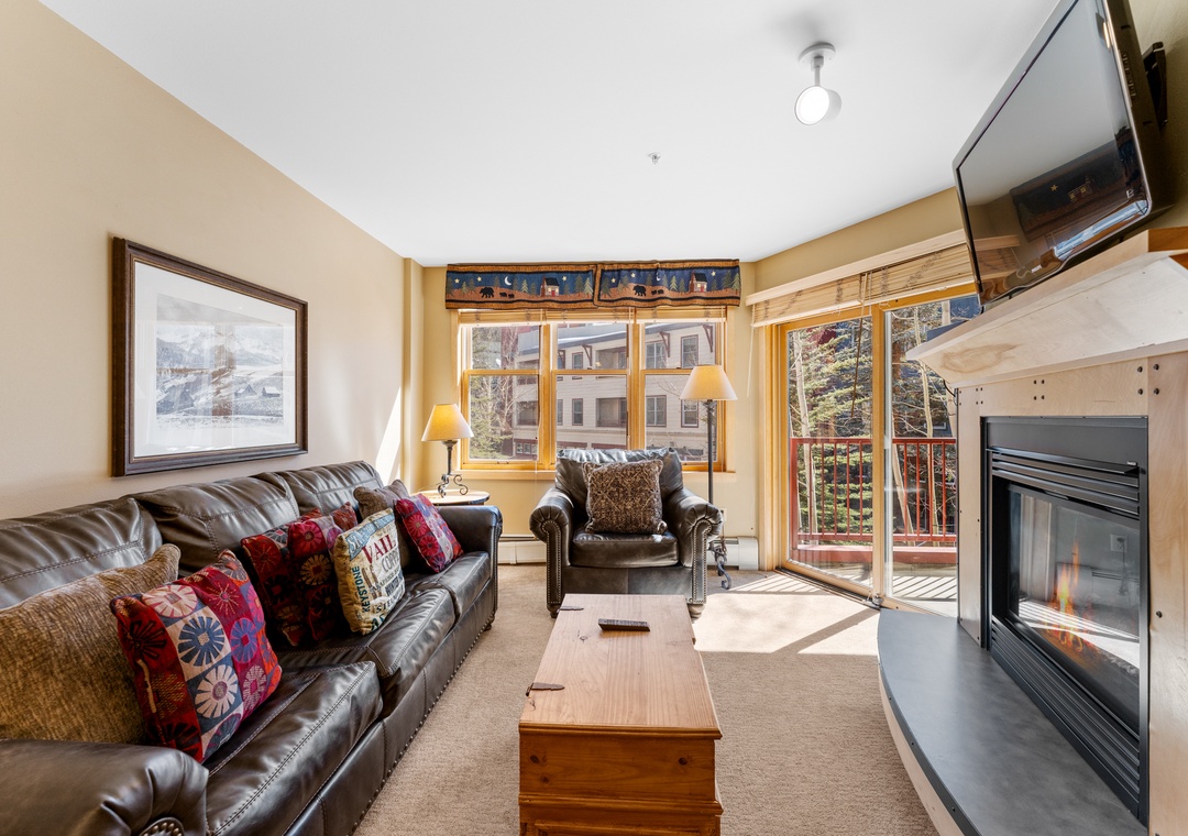 Cozy up in your mountain retreat with leather seating by the fireplace, balcony access, and warm touches throughout.