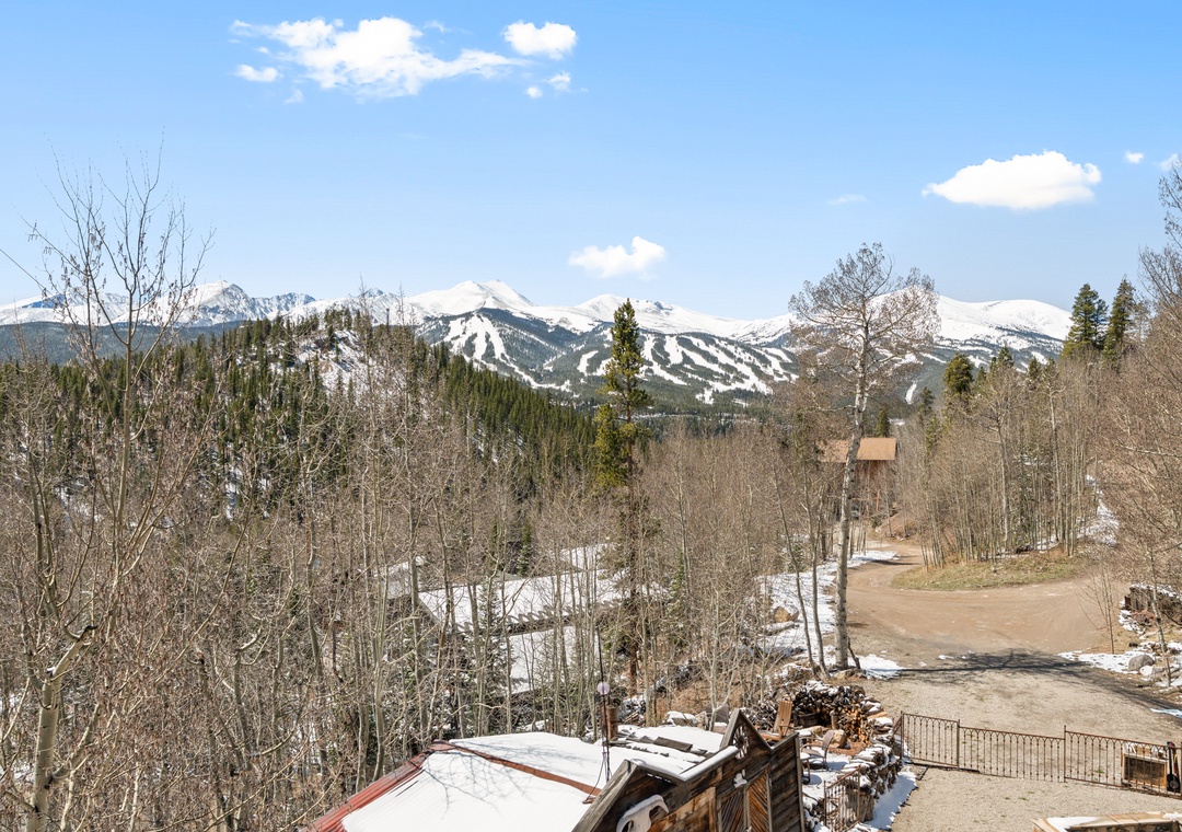 Stunning ski slopes dominate the horizon with snow-capped peaks framing this mountain property's location. Late-season conditions offer access to nearby winter recreation.