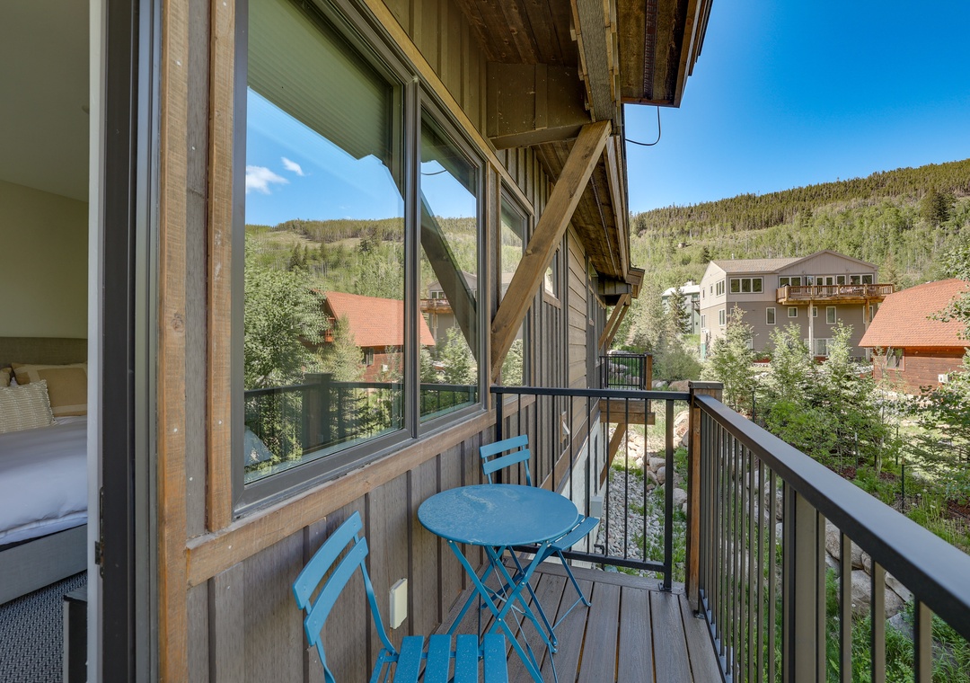Step onto your private balcony and savor mountain views with your morning coffee at this charming bistro set.