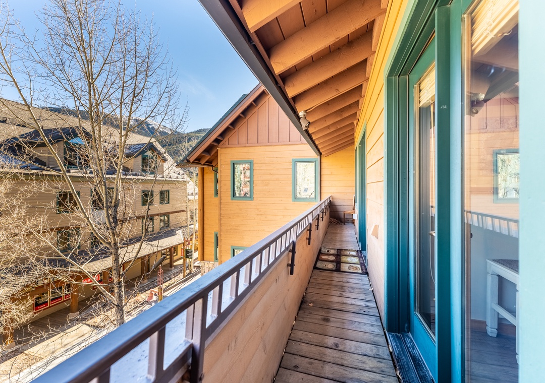 Step onto your private wooden balcony where you can sip morning coffee while taking in charming alpine village views and crisp mountain air.