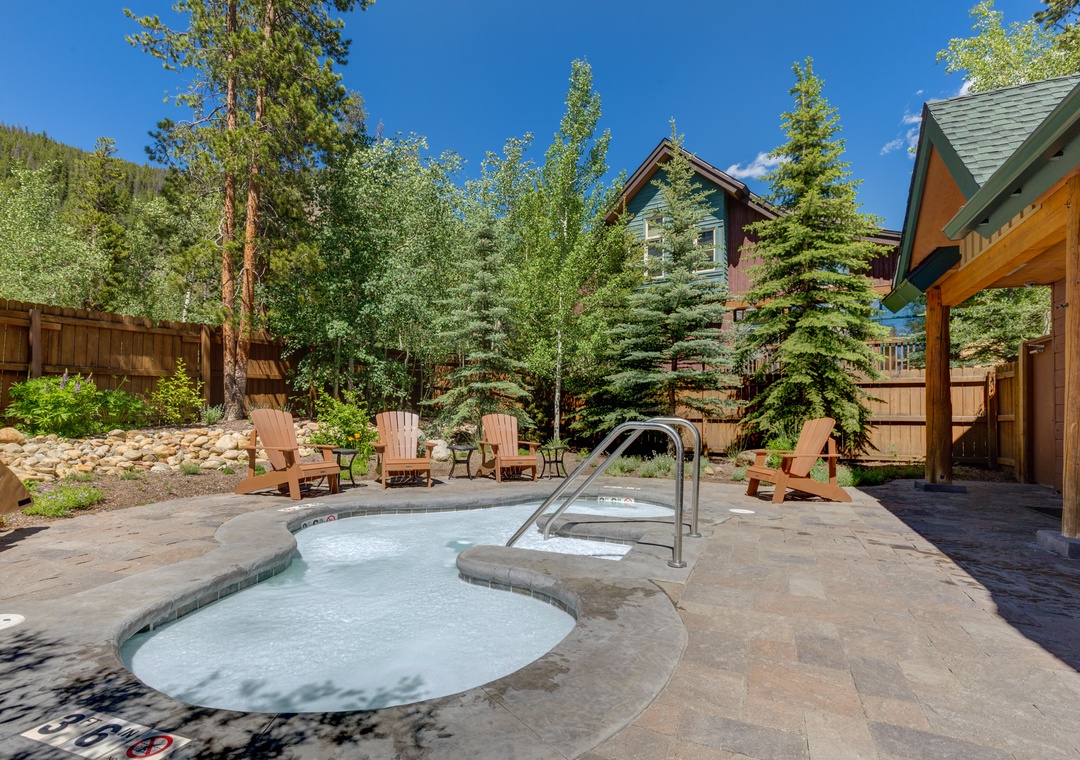 Soak in your private hot tub surrounded by towering pines and mountain air, with cozy Adirondack chairs perfect for relaxing after your soak.