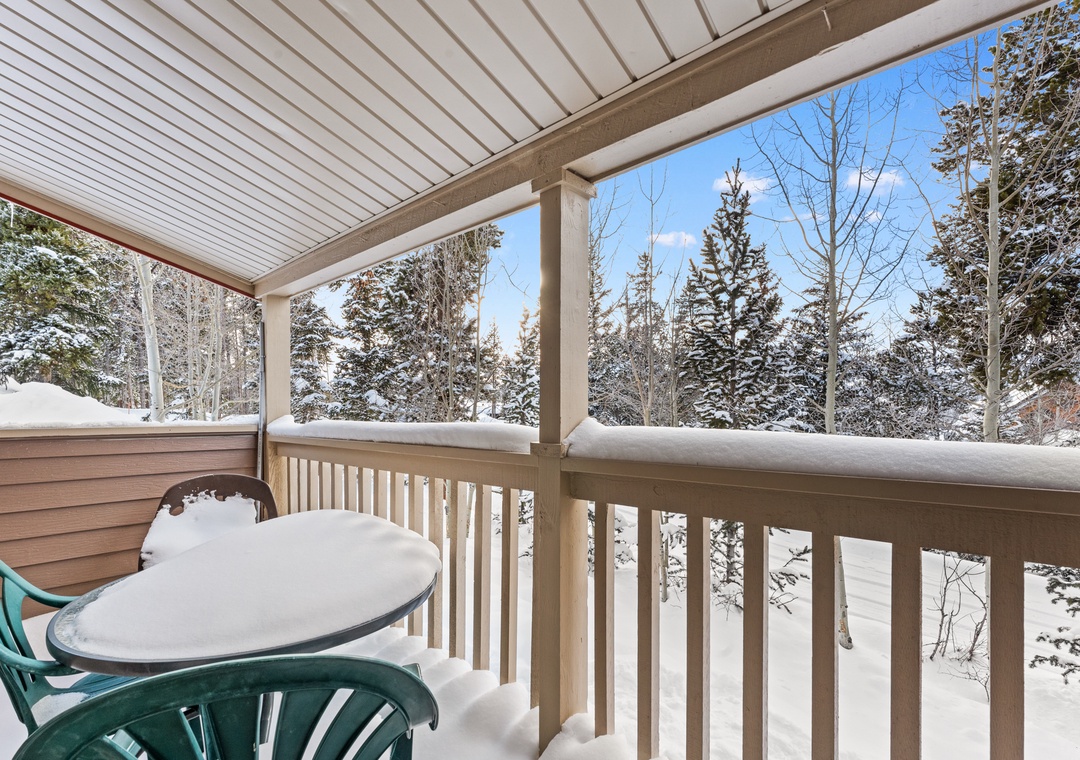 Your private covered balcony offers peaceful winter forest views where you can sip morning coffee surrounded by snow-dusted evergreens.