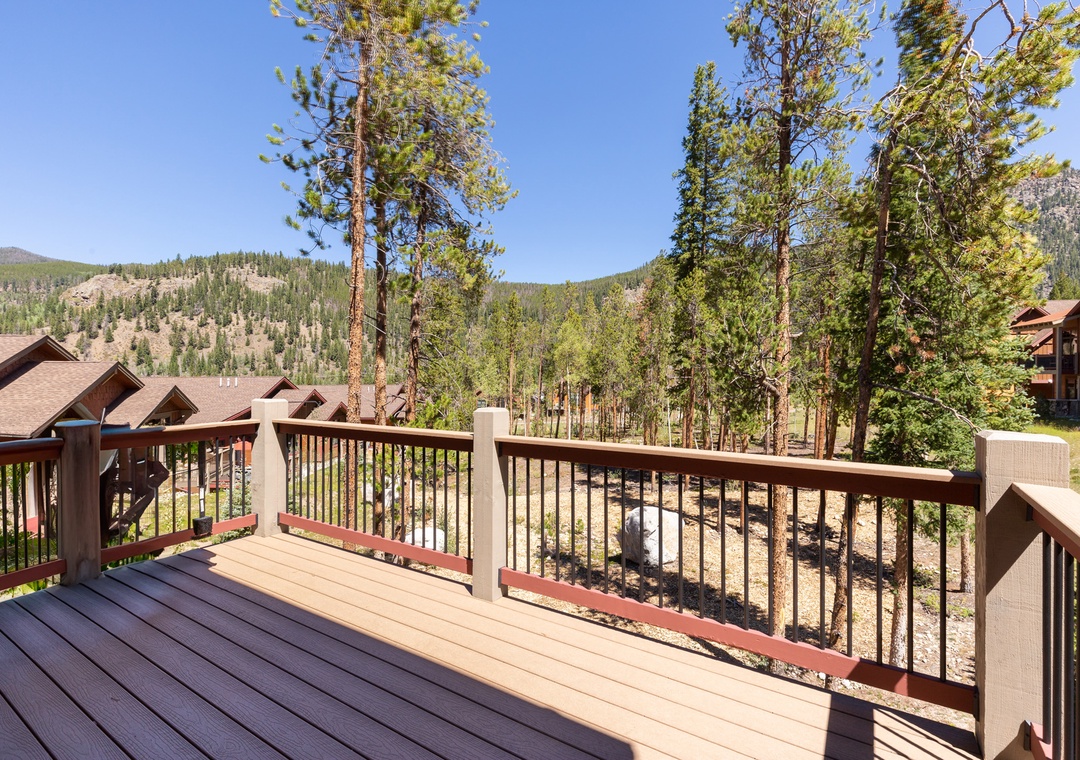 Step onto your private deck and breathe in the fresh mountain air while soaking up stunning forest views that stretch endlessly before you.