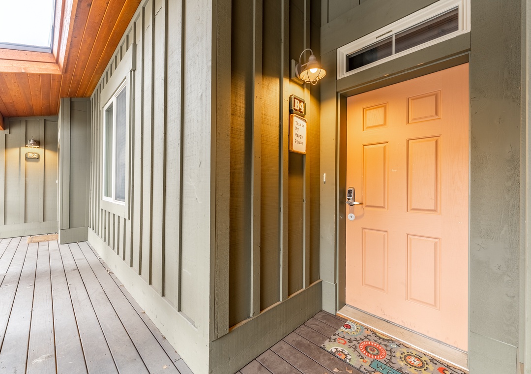 Welcoming entrance with warm lighting and charming details creates the perfect arrival moment for your mountain getaway.