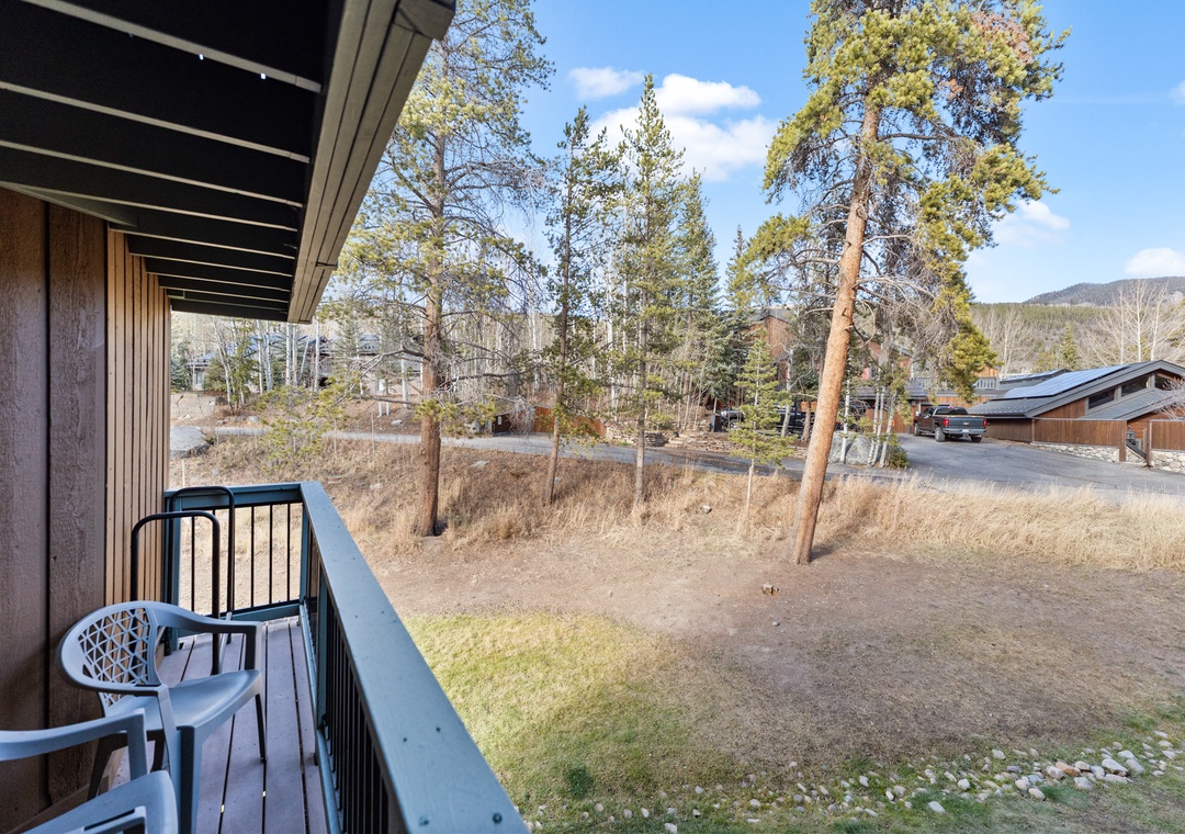 Your private balcony overlooks peaceful mountain neighborhood views, perfect for morning coffee with fresh alpine air.