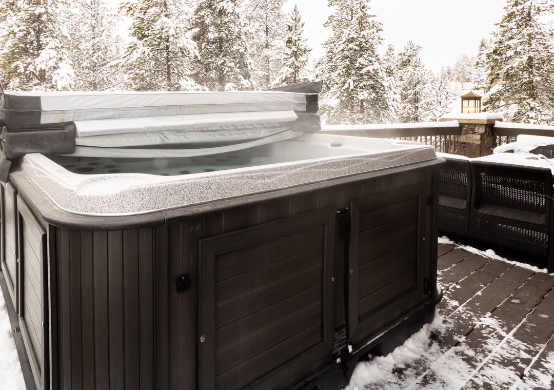 Soak in your private hot tub surrounded by snow-laden pines, where winter's magic meets ultimate relaxation.