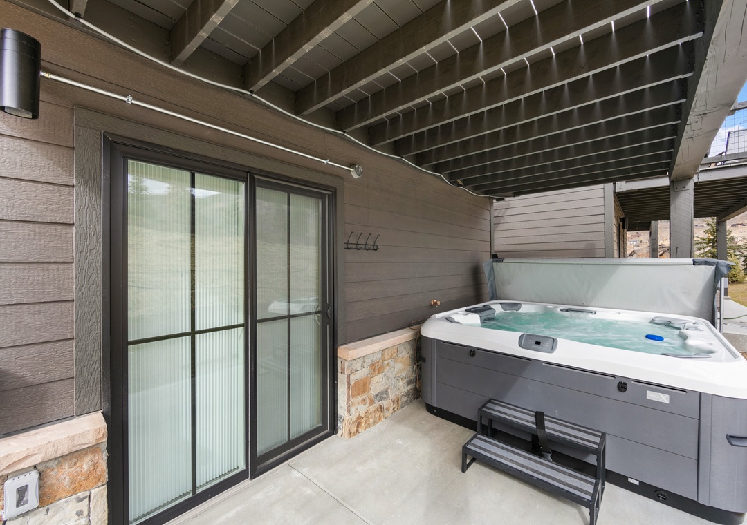 Soak your cares away in your private hot tub on this sheltered terrace, where modern comfort meets mountain relaxation.