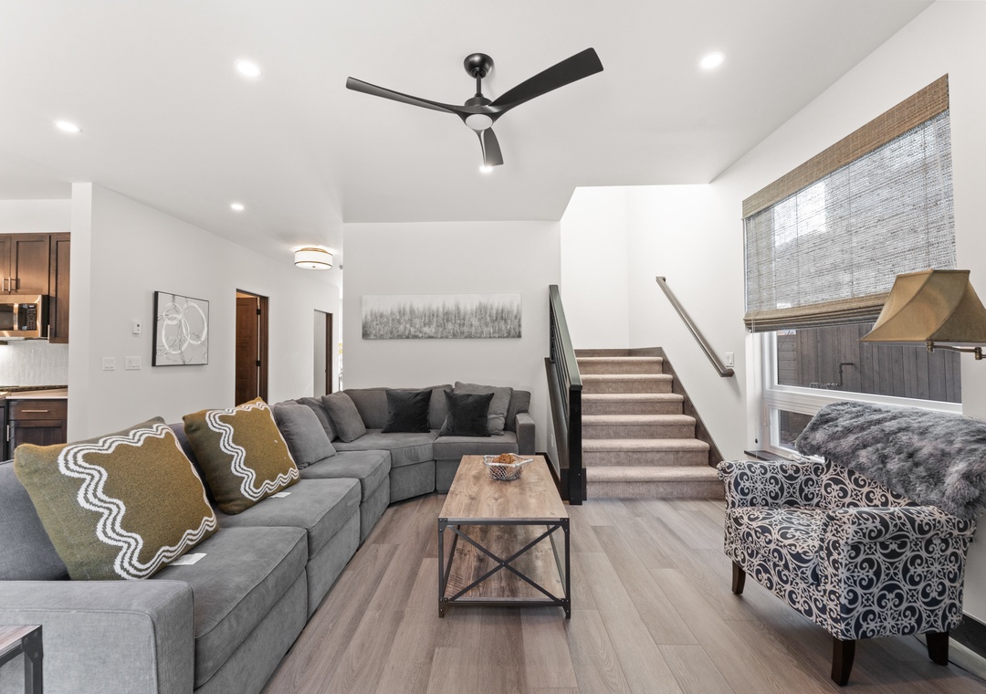 Sink into plush sectional seating where modern comfort meets stylish design in your spacious living area.