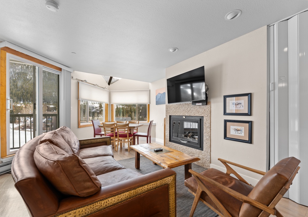 Sink into soft leather seating by your crackling fireplace while enjoying mountain views through floor-to-ceiling windows.
