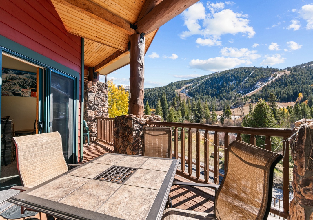 Sip your morning coffee on this private balcony while mountain peaks create your perfect backdrop.