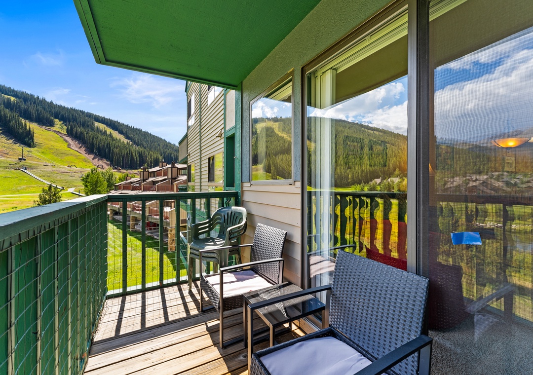 Step onto your private balcony and breathe in the crisp mountain air while taking in sweeping views of green valleys and forested peaks.
