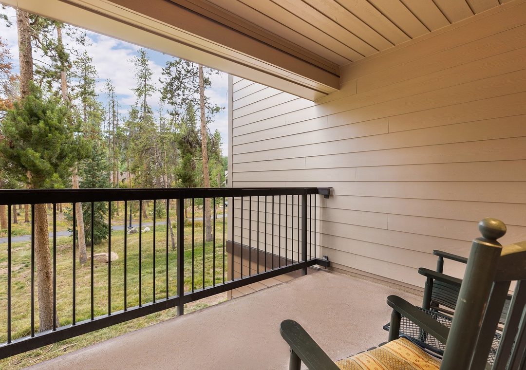 Your private balcony offers peaceful forest views where you can unwind with morning coffee or evening relaxation.