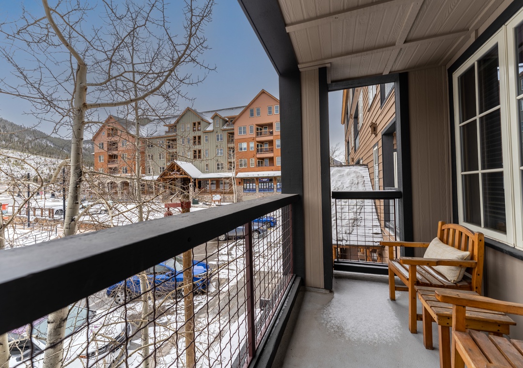 Your private balcony offers stunning mountain views and cozy seating where you can sip morning coffee while taking in the winter wonderland below.