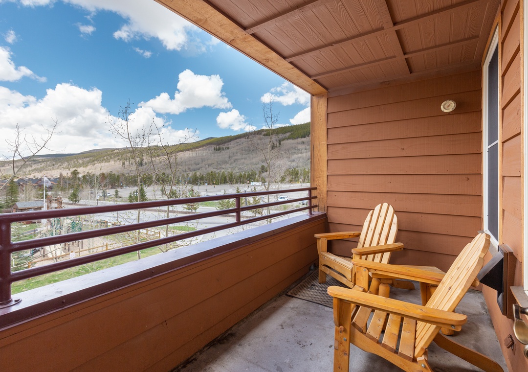 Sink into comfortable wooden chairs on your private balcony and soak up breathtaking mountain views in crisp, refreshing air.