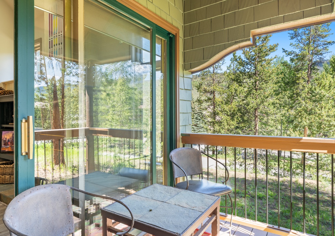 Step onto your private balcony and breathe in the forest air while sipping morning coffee surrounded by towering trees.