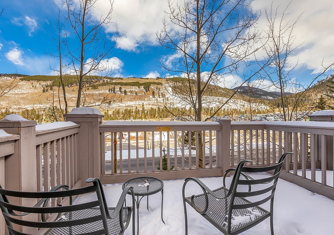 Step onto your private balcony and breathe in crisp mountain air while enjoying stunning snow-capped peaks and winter wilderness views.